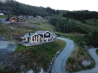 an aerial view of a house on a hill at Pudderhytta in Sogndal