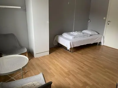 a room with a bed and a table and a chair at Sogndal Bed & Breakfast in Sogndal