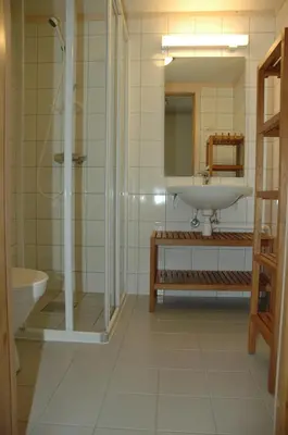 a bathroom with a shower and a sink and a tub at Nystuen in Tyinkrysset