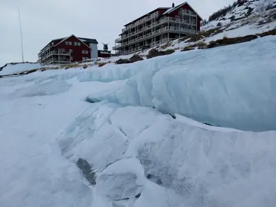 a large chunk of snow on top of a mountain at Nystuen in Tyinkrysset
