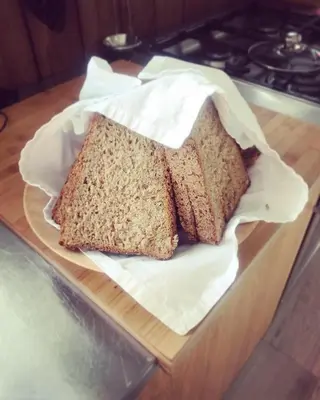 a loaf of bread sitting on a cutting board at SAGA, unikt badehotell med 5 rom, sauna og badebrygge - Inderøy in Straumen