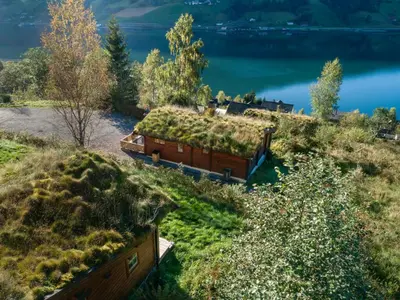 a bus full of grass on the side of a hill at Chalet Fjordblick I by Interhome in Olden