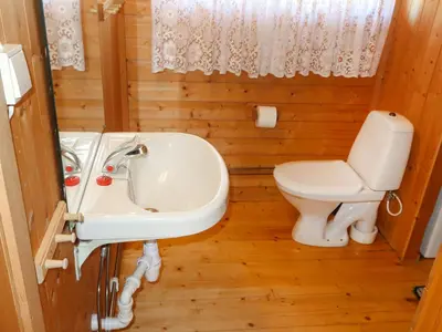 a bathroom with a sink and a toilet at Holiday Home Sandvikfjellet by Interhome in Nyttingsnes