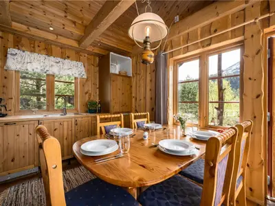a dining room with a wooden table and chairs at Holiday Home Lona by Interhome in Viksdalen