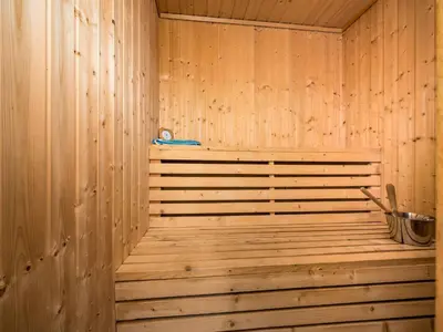 a wooden sauna with a wooden tub in a room at Holiday Home Lona by Interhome in Viksdalen