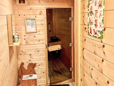 a wooden cabin with a door into a room at Holiday Home Elistova by Interhome in Onarheim