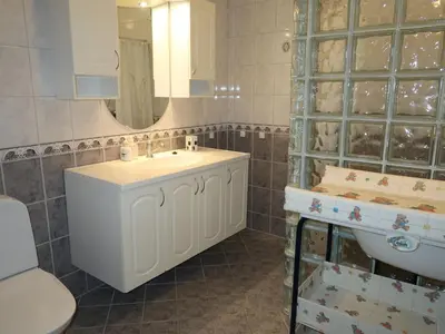 a bathroom with a sink and a toilet at Holiday Home Gule huset by Interhome in Bruntveit