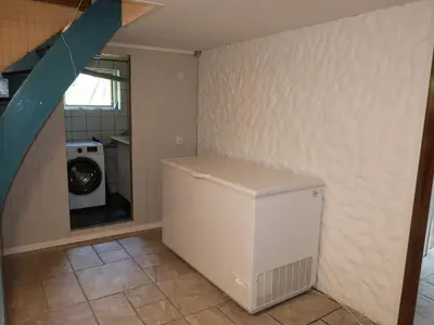 a laundry room with a washer and dryer at Holiday Home Gamlahuset by Interhome in Bruntveit