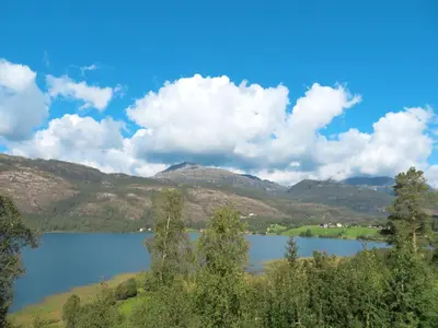 a view of a lake with mountains in the background at Chalet Anna by Interhome in Eikelandsosen
