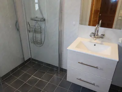 a bathroom with a sink and a shower at Holiday Home Ikjefjord by Interhome in Bjordal