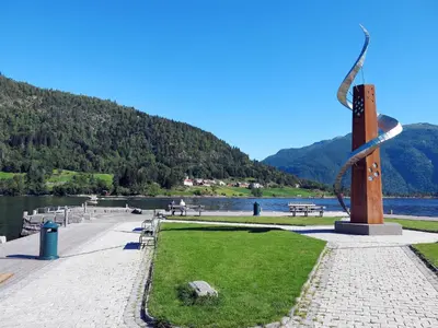 a sculpture in a park next to a body of water at Chalet Naustet by Interhome in Balestrand