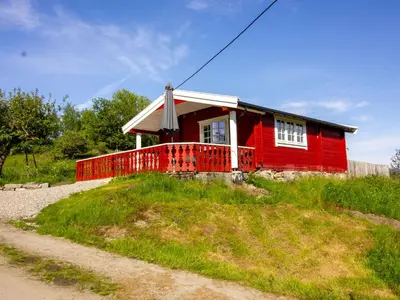 a red house sitting on top of a hill at Holiday Home Naustvollen by Interhome in Balestrand