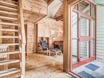 a wooden room with a window and a chair at Holiday Home Veganeset I by Interhome in Balestrand