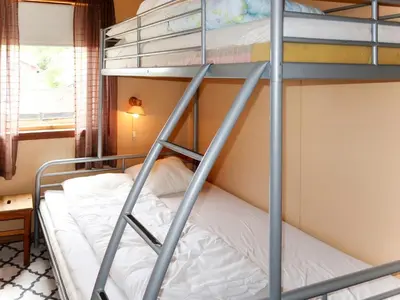 a bunk bed in a room with a bunk bedutenewayangering at Apartment Mjellhaugen by Interhome in Naustdal i Sunnfjord
