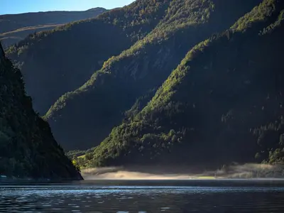 a view of a mountain range with a body of water at Holiday Home Frigg by Interhome in Arnefjord