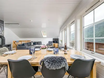 a dining room with a table and chairs at Holiday Home Frigg by Interhome in Arnefjord