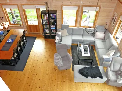 a living room with a couch and a table at Holiday Home Peer Gynt by Interhome in Sogndal