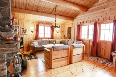 a living room with a couch and a table at Langlofonna in Stranda