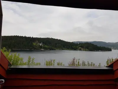 a view of a lake from a window at Villa Oleanna in Lysekloster