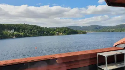 a view of a lake from the deck of a boat at Villa Oleanna in Lysekloster