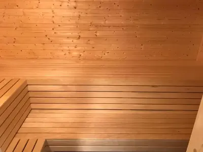 a wooden sauna with a wooden floor at Lillebjørn in Trysil