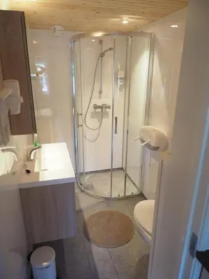a bathroom with a shower and a toilet at Valsøya in Valsøyfjord