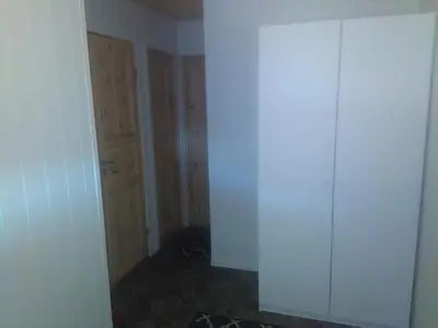 an empty room with a closet and a door at Bjørgo Gard - Stegastein in Aurland