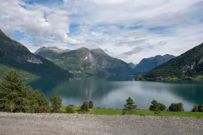 a view of a lake with mountains in the background at Furetoppen Panorama in Stryn