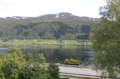 a view of a lake with mountains in the background at Voss- Oppheim suite private cozy cabin in Vossestrand
