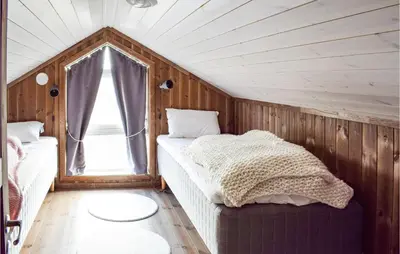 a small bedroom with a bed and a window at Gorgeous Home In Sjusjøen With Wifi in Sjusjøen