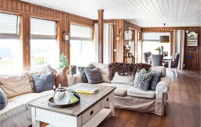 a living room with couches and a table at Gorgeous Home In Sjusjøen With Wifi in Sjusjøen