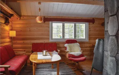a living room with a couch and a table and chairs at Nice Home In Gol With Kitchen in Gol