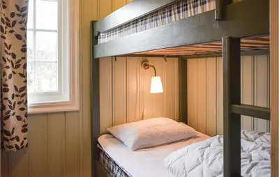 a bedroom with a bunk bed and a window at Stunning Home In Hemsedal With Kitchen in Hemsedal