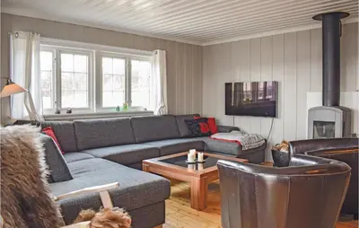 a living room with a couch and a table at Stunning Home In Hemsedal With Kitchen in Hemsedal