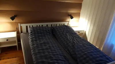 a bed in a room with a bed frame at Kvambekk Gard i Åmotsdal in Åmotsdal