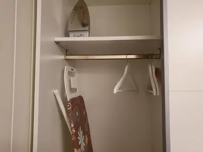 a skateboard is hanging in a closet at Bårdshaug Studio Apartment in Orkanger