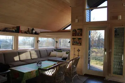 a living room with a couch and a table at Lev-Vel - 10 person cabin in Ål