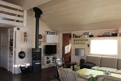 a living room with a couch and a wood stove at Lev-Vel - 10 person cabin in Ål