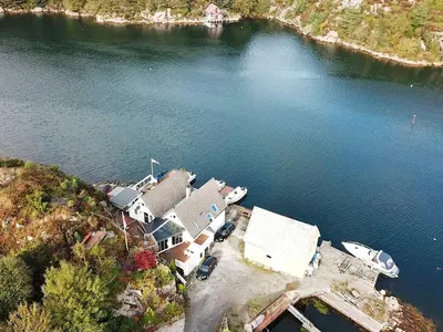 an aerial view of a house on the water at Seaside Fisherman s Haven-By Traum in Steinsbø