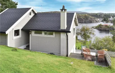 a house with a view of a body of water at 2 Bedroom Cozy Home In Hauglandshella in Kolavåg