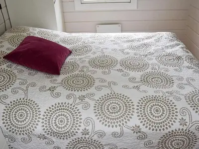 a bed with a purple pillow on top of it at Cozy Cottage Retreat in Trend-By Traum in Frei