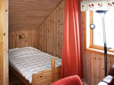 a bedroom with a bed in a room with a window at 6 person holiday home in Brekstad in Brekstad