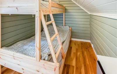 a bunk bed in a tiny house at 2 Bedroom Amazing Apartment In Vestnes in Vestnes