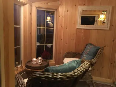 a living room with wicker chairs and a table at Veslehytta - cabin 1050 moh via amazing view and ambiance in Ål