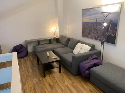 a living room with a couch and a table at Actif 305 Apartment by Ål Ski Center in Ål