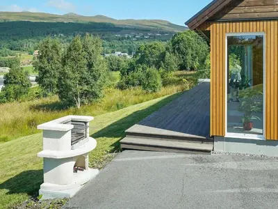 a porch of a house with a view of a road at 8 person holiday home in Åram in Sandvik