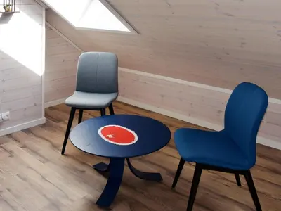 two chairs and a table in a room at 8 person holiday home in Åram in Sandvik