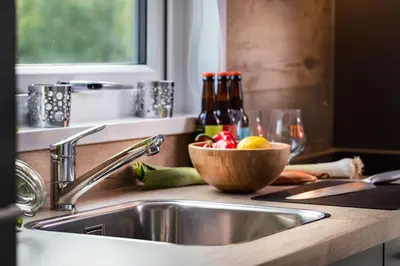 a kitchen counter with a sink and a bowl of fruit at Topcamp Hallingdal - Ål in Ål