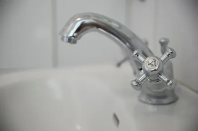 a bathroom sink with a silver faucet at Skjerjehamn in Ånneland