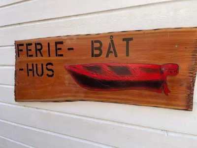 a sign on the side of a house that says here fuelling has bat at 6 person holiday home in ETNE in Etnesjøen